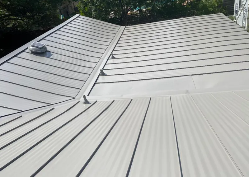 Solar attic fan installed on a metal roof for Roof Ventilation in Sauk Rapids